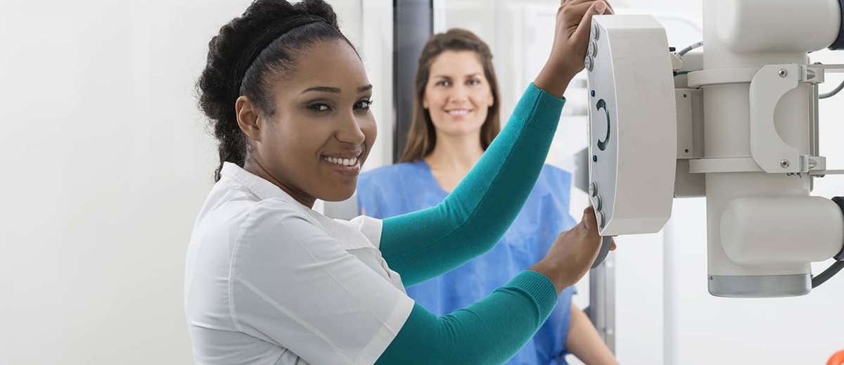 primaMED student adjusting imaging equipment in the lab