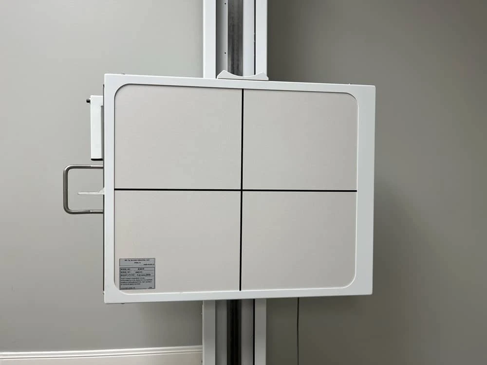 Instructor demonstrating patient shielding and safety protocols